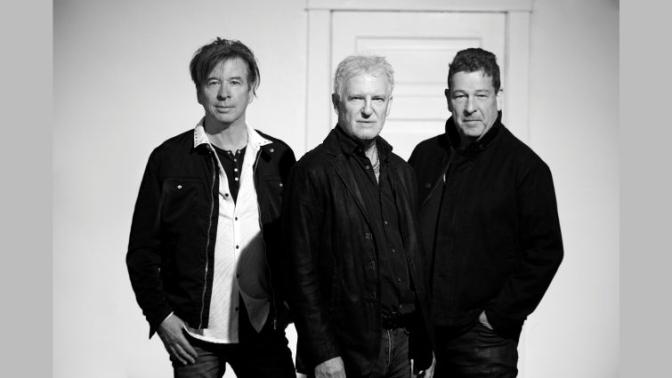black and white portrait of musical group Glass Tiger