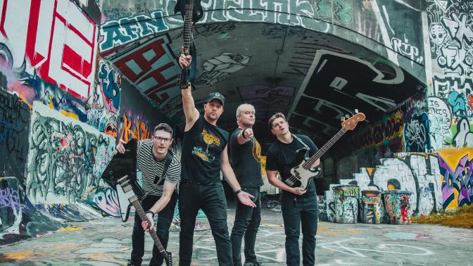 Band standing with guitars