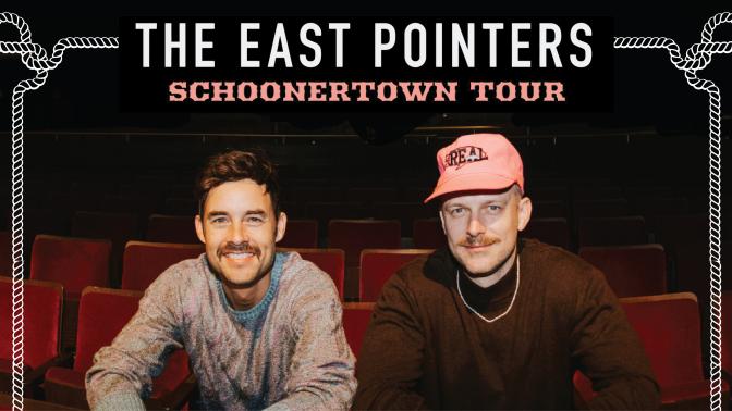 Musical Duo The East pointers smiling seated in red theatre seating