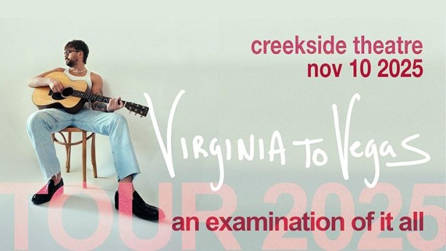 musician seated on a wooden chair leaned back and looking over his shoulder while playing a guitar