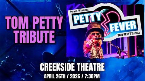Tom PEtty tribute artist in costume pointing at the viewer, shown with a blue background