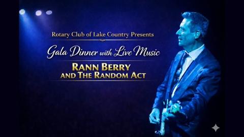 monochrome blue side angle portait of musicain rann berry on stage playing a guitar 