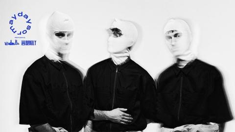 Three men in white balaclavas and black zip up shirts