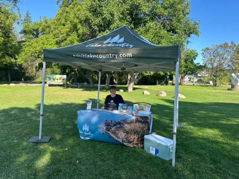 mobile visitor info table and tent at a local park