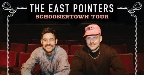 Musical Duo The East pointers smiling seated in red theatre seating