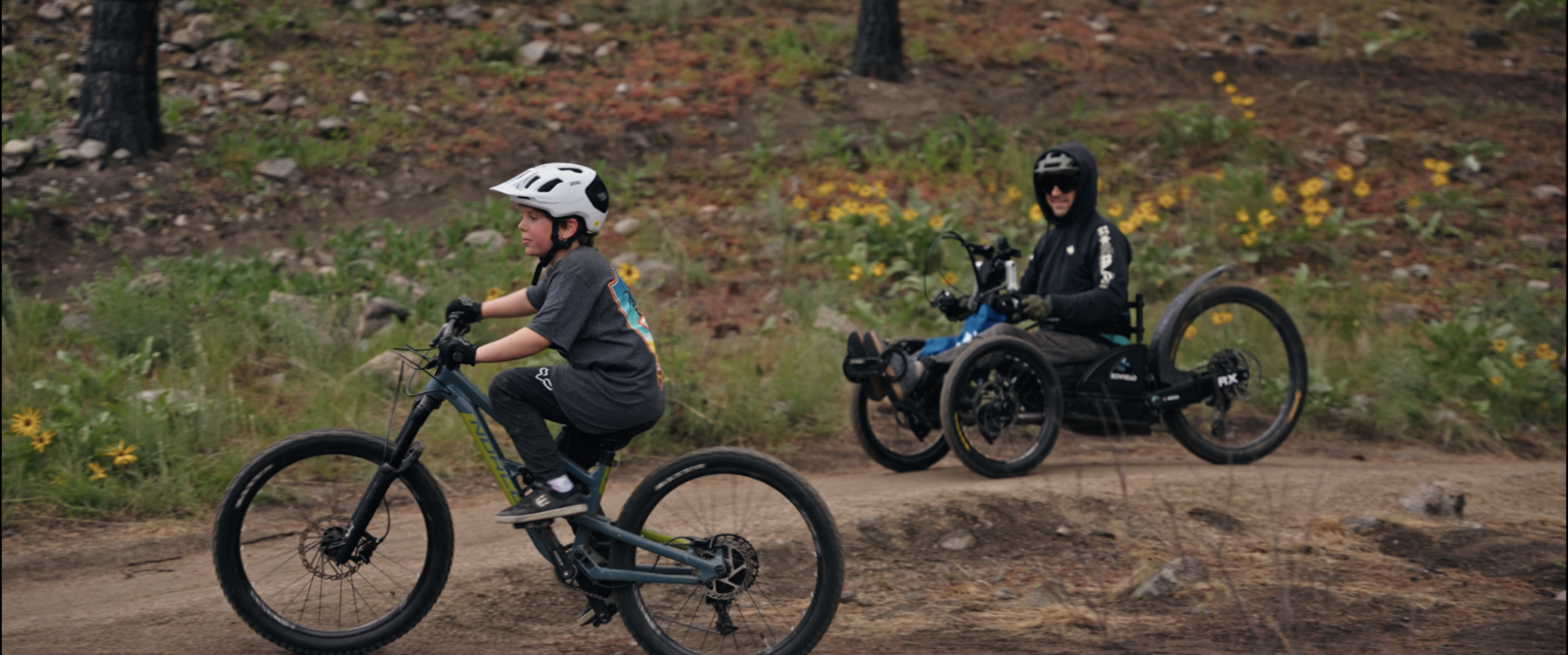 Josh Dueck and son on adaptive trail