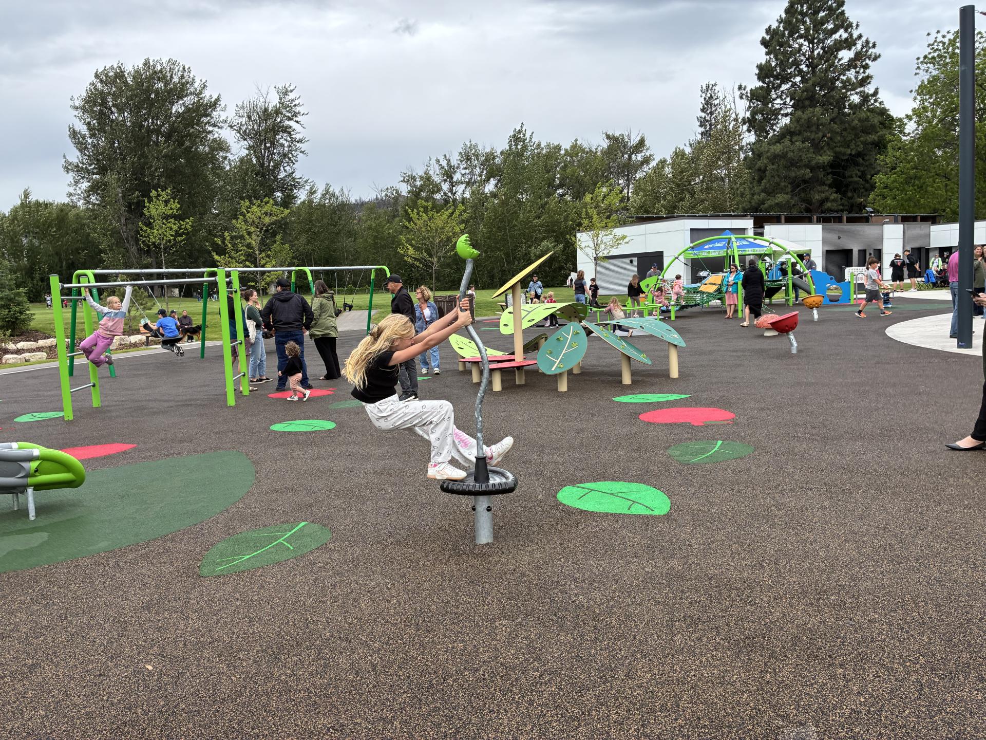 children play on new playground features